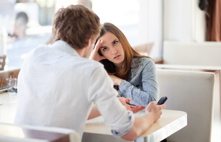 Young couple fighting in coffee shop. Relationship problems.