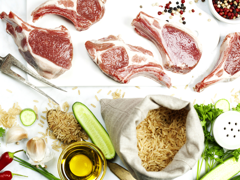 Brown rice and Raw lamb chops - cooking or healthy eating concept